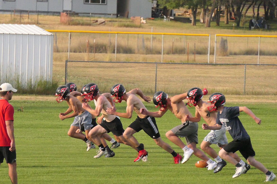 Running is a must in 6-player football and the Hot Springs Savage Heat do lots of it during practice. (Chuck Bandel/VP-MI)