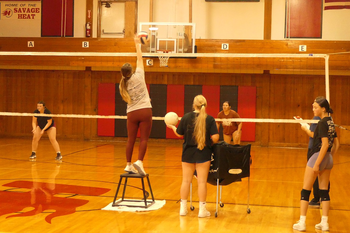 Players work on shots and defense at the net during a Lady Heat practice this past week in Hot Springs. (Chuck Bandel/VP-MI)