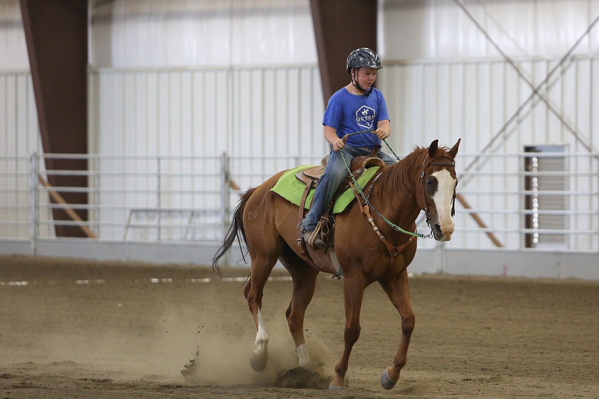 A rider with the Grant County Youth Equine Program competes in a keyhole race Friday at the Harwood Pavilion at the Grant County Fairgrounds.