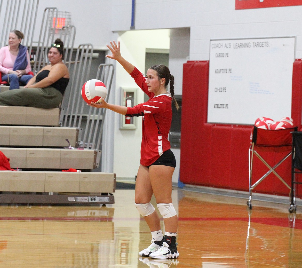 Sandpoint High senior Audrey Petruso gets ready to serve for the Bulldogs during a home match last season.