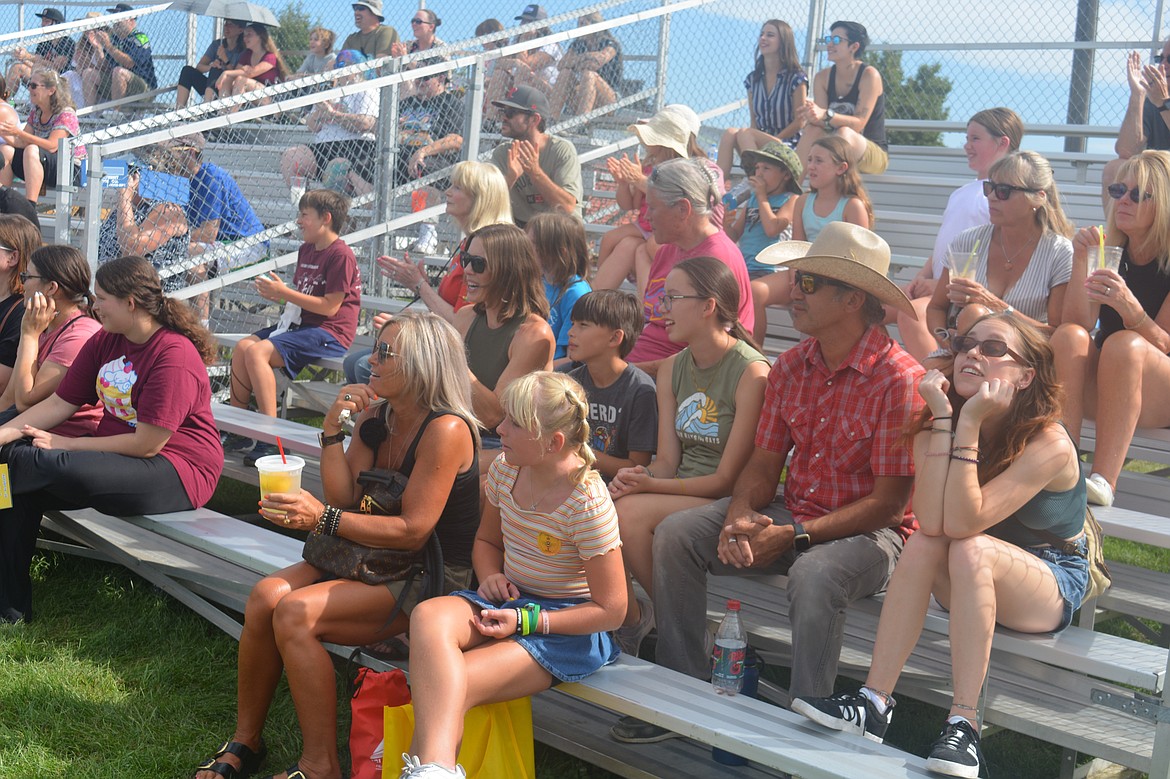 Jamie Bodnar, Colter Bodnar, Delia Bodnar, Justin Bodnar and Sonja Bodnar cheer on the dogs performing during the Extreme Dogs Stunt Dog Show.