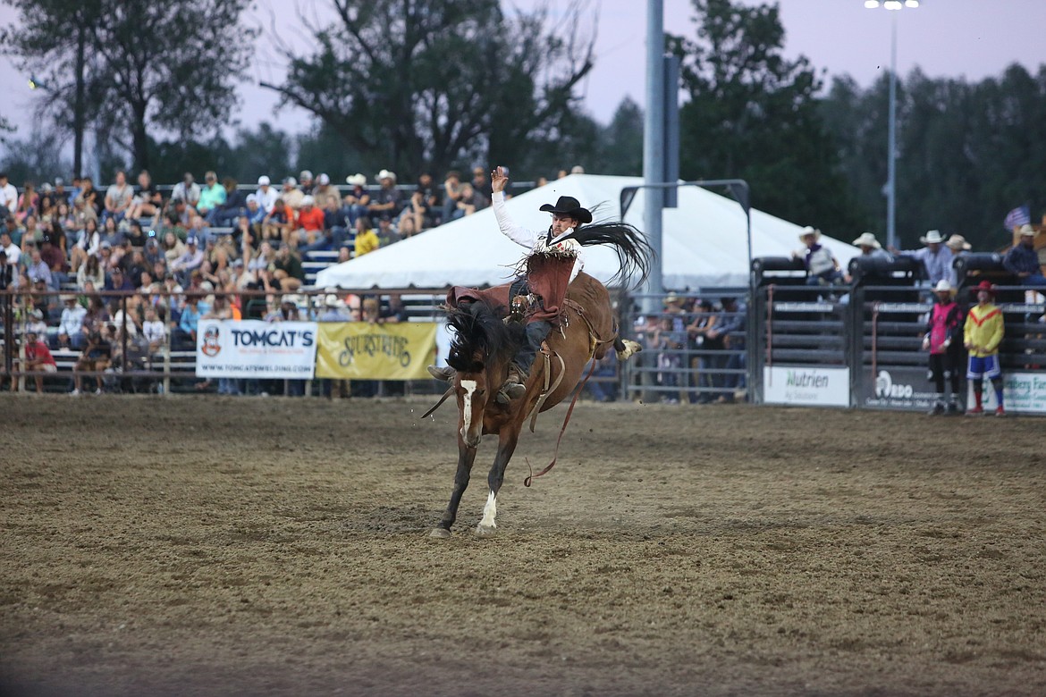 Kody Lamb, of Sherwood Park, Alberta, competes in the bareback riding event at Saturday’s performance of the Moses Lake Roundup.