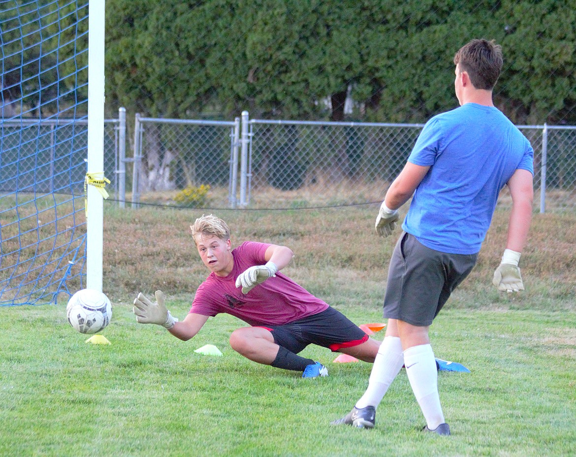 Goalkeeper Cardon Pluid practices defense drills at practice.