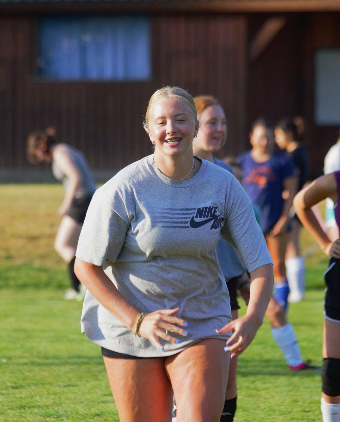 Hallie Thomson runs through a sprinting drill at practice.