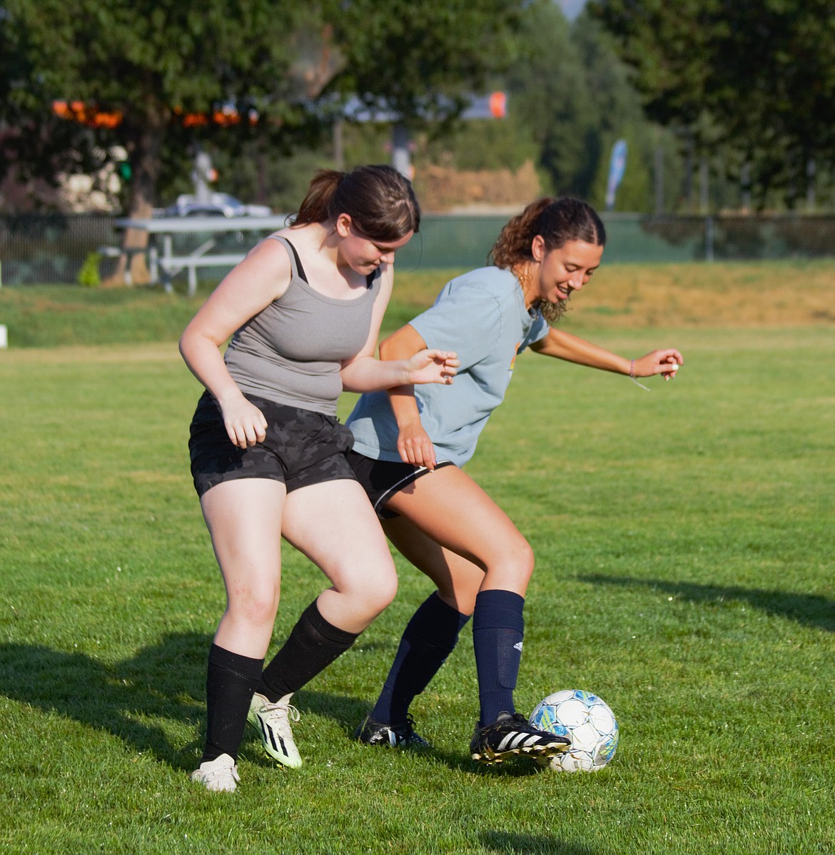 (right) Senior Brooke Petesch plays keep-away from a teammate during a drill at practice.