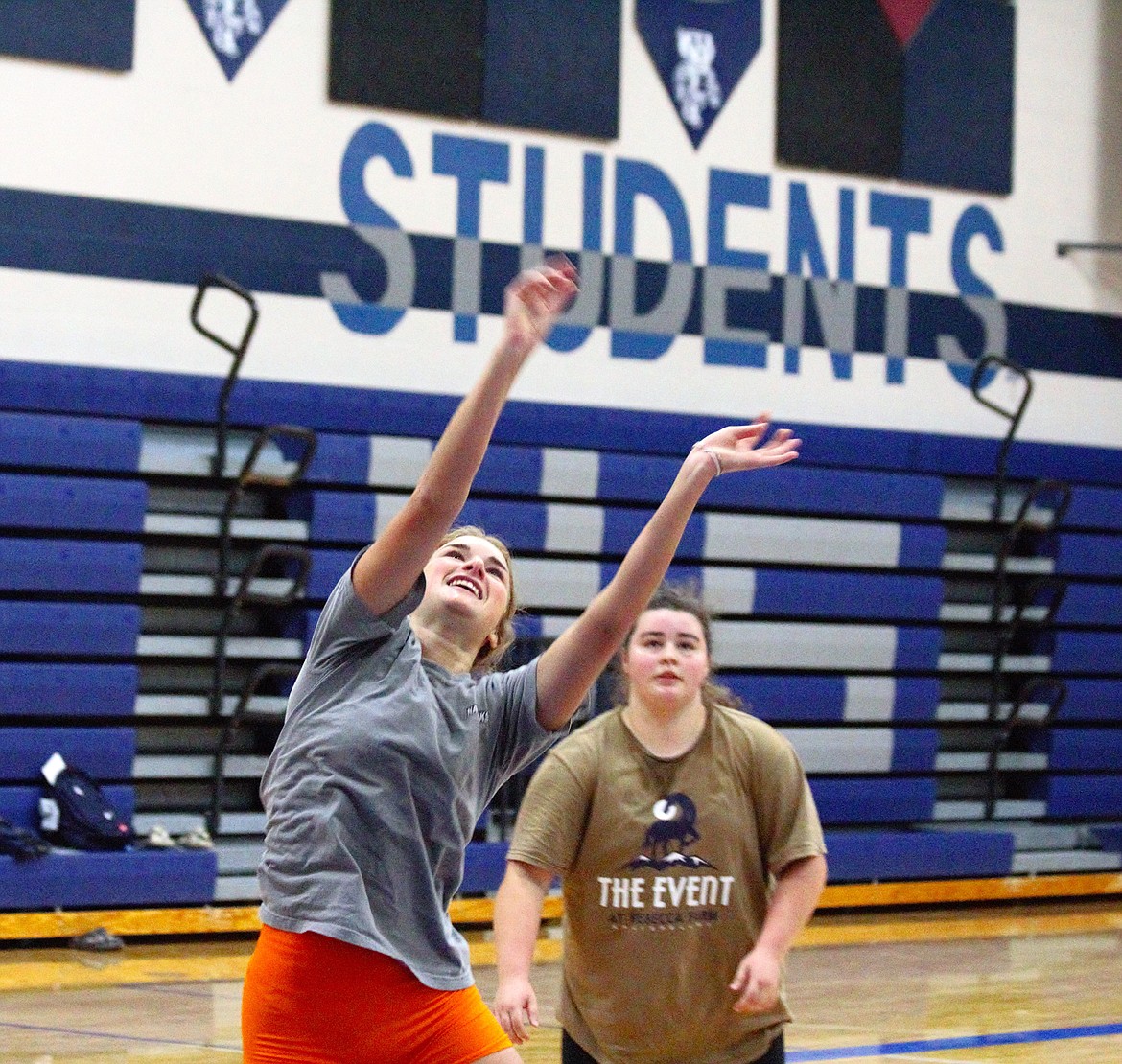 Ellie Falck sets the ball during a drill at practice.