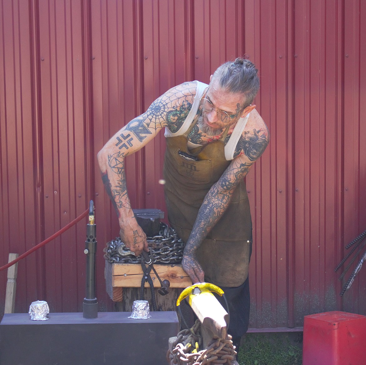 A blacksmith works his smithy at The Bruce Festival.