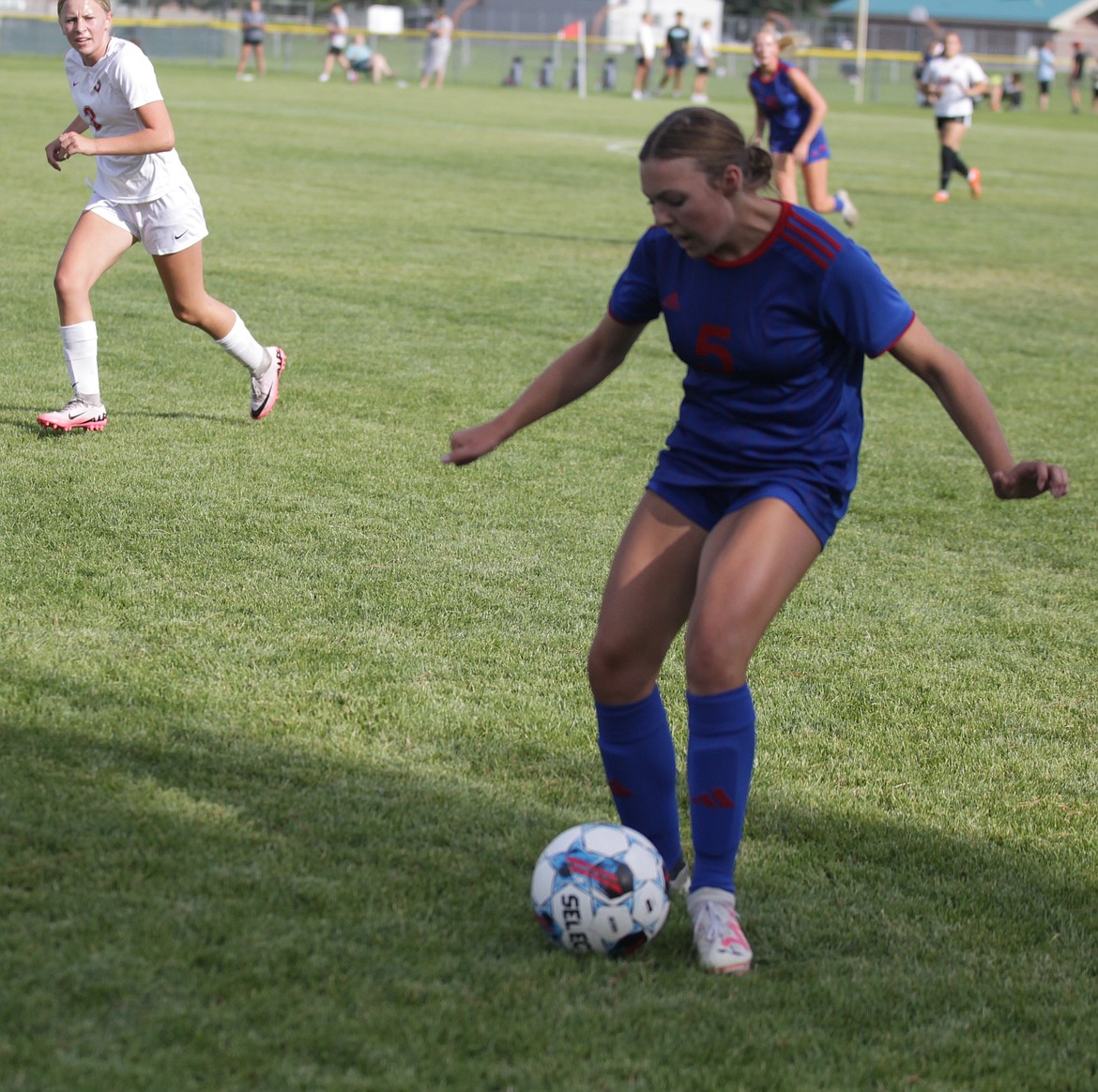 JASON ELLIOTT/Press
Coeur d'Alene freshman Audrey Linder plays the ball up the field during a scrimmage match with Sandpoint in the YEA Jamboree on Tuesday at Lake City High.