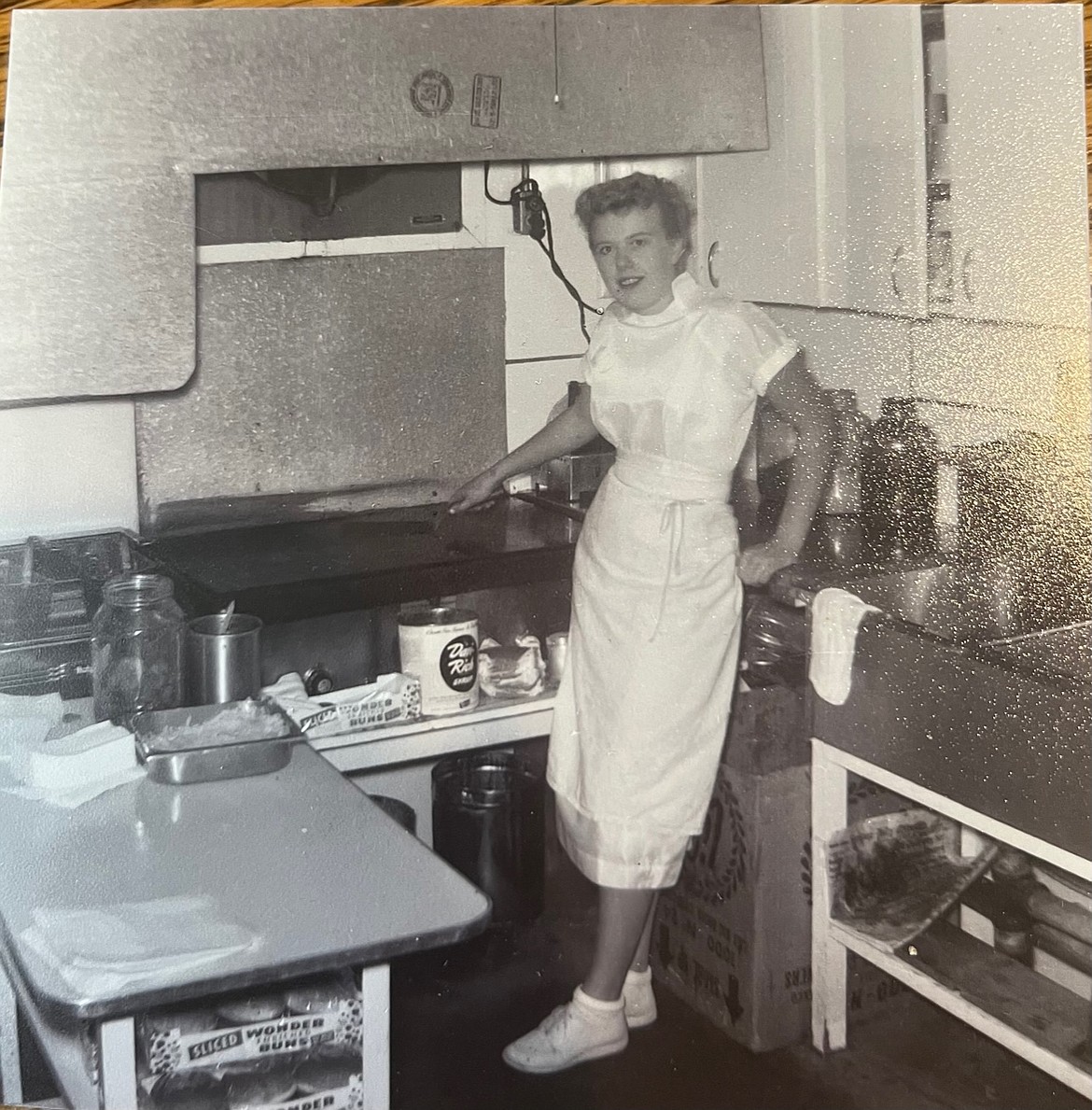 Gay Carlberg Winger works the Dairy Queen grill in Coeur d'Alene in 1954.