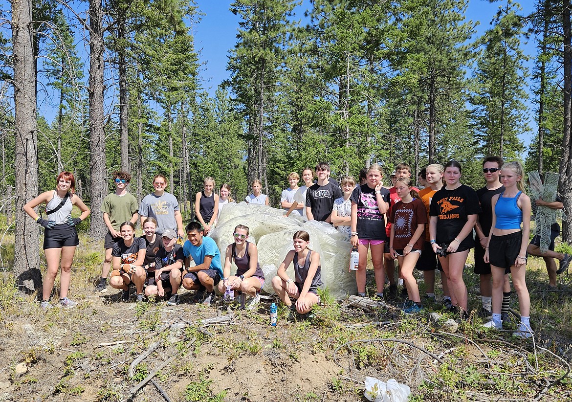 Courtesy photo
Members of the Post Falls High cross country team spent Monday cleaning plastic netting from the woods at Farragut State Park as a community service. On Tuesday, the Timberlake High cross country team finished cleaning out the plastic from a 16-acre area that the Lake City High cross country team started cleaning in June.