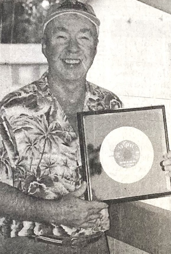 In 1994, Dave Wilson, formerly of The Cascades, posed with his gold record for “Rhythm of the Rain."