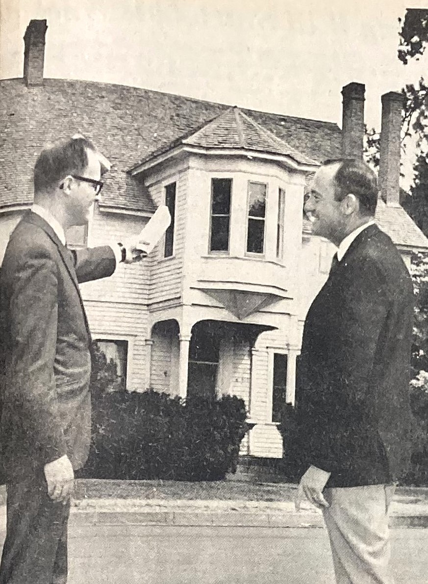 In 1969, North Idaho Junior College President Barry Schuler, left, and Dean of Faculty Ray Stone discussed the college purchase of the historic Fort Sherman officers’ quarters.