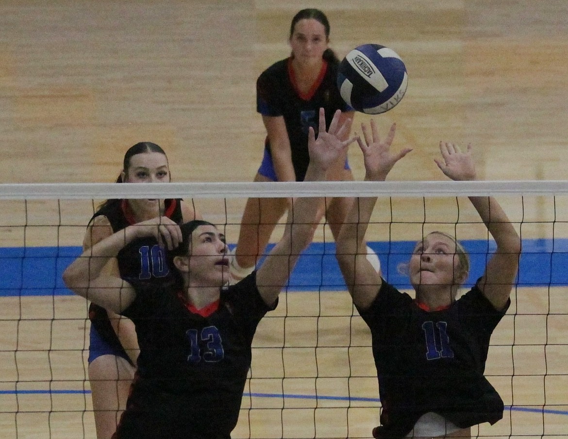 JASON ELLIOTT/Press
Coeur d'Alene's Hannah Shafer and Gianna Callari attempt to block a Moscow return during their match in the YEA Jamboree on Wednesday.