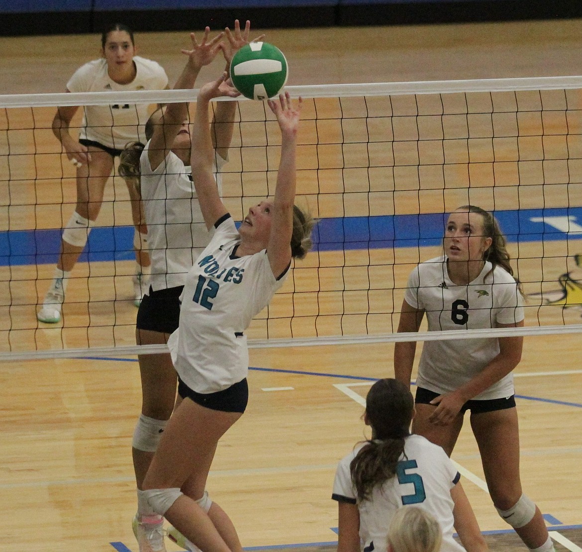 JASON ELLIOTT/Press
Lake City's Kate Moglia attempts to set the ball to a teammate as Lakeland's Lexi Levesque defends during their match in the YEA Jamboree on Wednesday at Coeur d'Alene High.