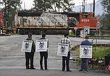 Canadian government scrambles to resolve labor dispute as 2 major freight railroads shut down