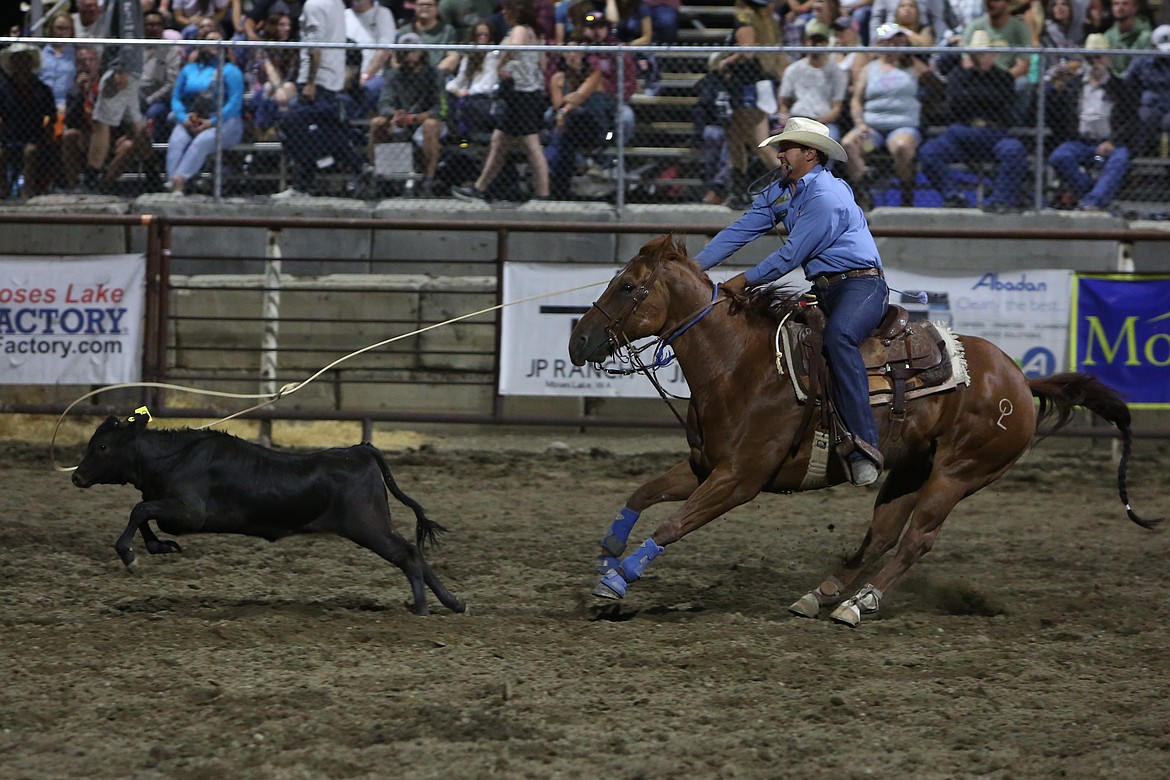 Tie-down roper Quade Hiatt, hailing from Canyon, Texas, lassos a steer at Saturday’s showing of the Moses Lake Roundup.