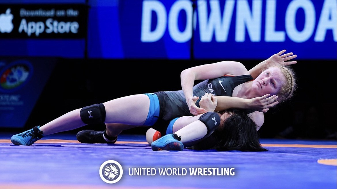 GLACIER HIGH wrestler Kaura Coles, wrestling for Canada, closes out her pin of Japan’s Nana Kozuka in the finals of the 53-kilogram bracket of the U17 World Championships Saturday in Amman, Jordan. (photo courtesey of United World Wrestling)