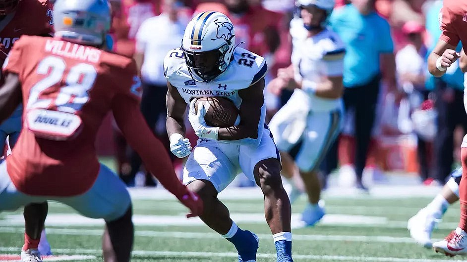 MONTANA STATE running back Scottre Humphrey (22) picks up yardage in the Bobcats’ 35-31 win over New Mexico Saturday in Albuquerque, N.M. (Brian Morse/MSU Communications)