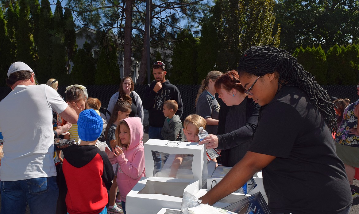 One hundred eighty students registered for Saturday's back-to-school event at the Children's Village and dozens of families came as "walkups."