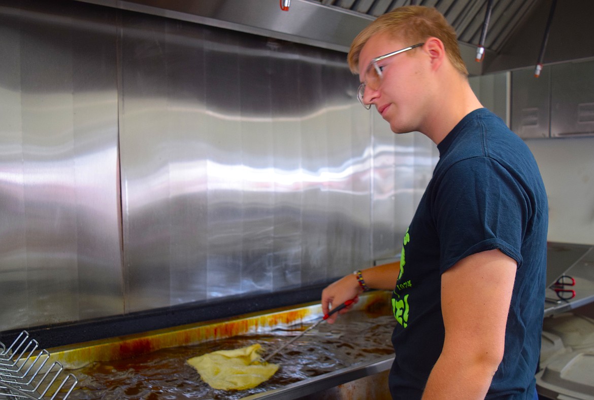 Thatcher Lybbert mans the fryer in The Original Elephant Ears booth.