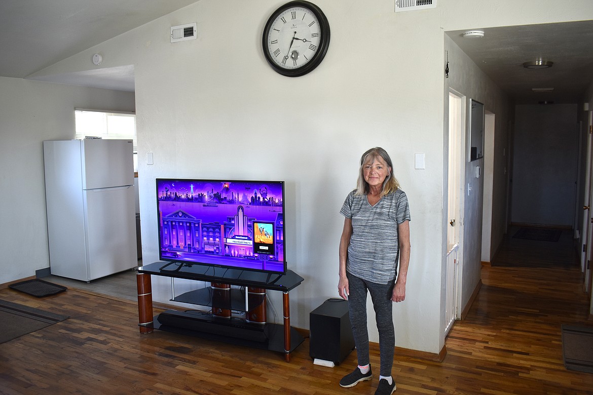 Shelly Johnson stands in the living room of Oxford House Blue Heron, where she lives with four other women in recovery. Blue Heron was a men’s house but was turned into a home for women and women with children earlier this month.