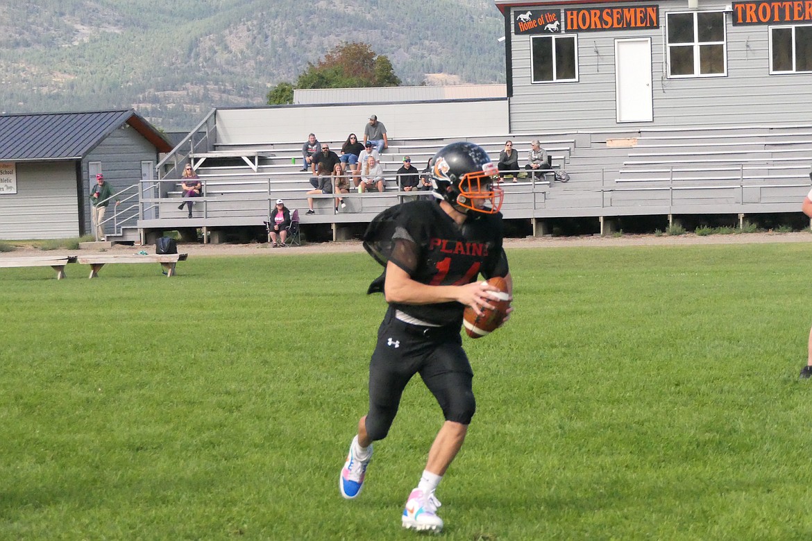 Plains High senior quarterback Darren Standeford drops back to pass during the Horsemen's scrimmage Saturday morning. (Chuck Bandel/VP-MI)