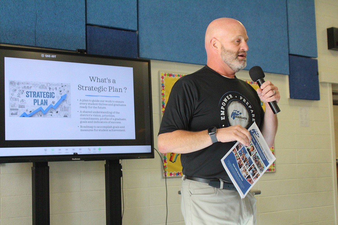 Warden Superintendent Scott West introduces the district’s newly updated strategic plan to parents at the district’s open house Monday.