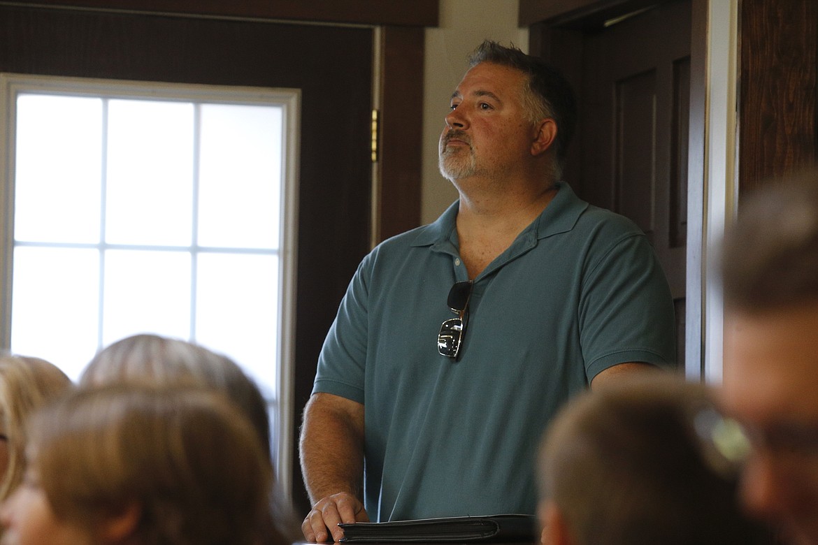 Michael Hardin watches an educational program about raptors.