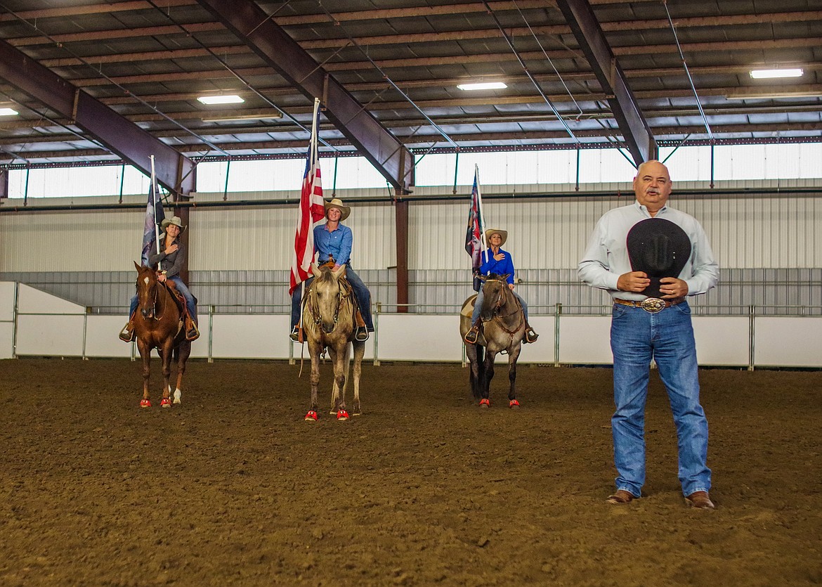 Buck Naff, right, sings the national anthem at last year’s Columbia Basin Barrel Racing Club Patriot Fall Classic Race. The CBBRC holds an opening ceremony honoring military members and lives lost in the 9/11 terror attacks.