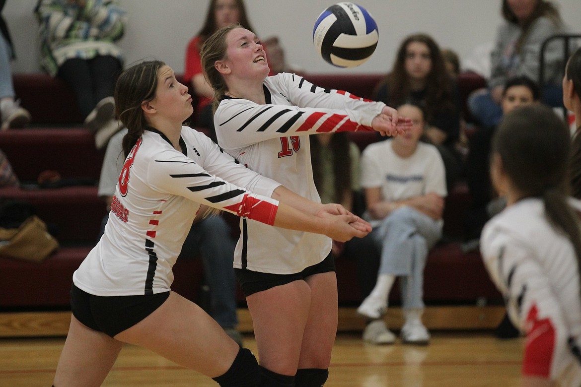 MARK NELKE/Press
Freshman Sadie Rose Davidson, left, of Kootenai and sophomore teammate Iva Hugo try to pass the ball against Coeur du Christ on Tuesday night at Holy Family Catholic School in Coeur d'Alene.