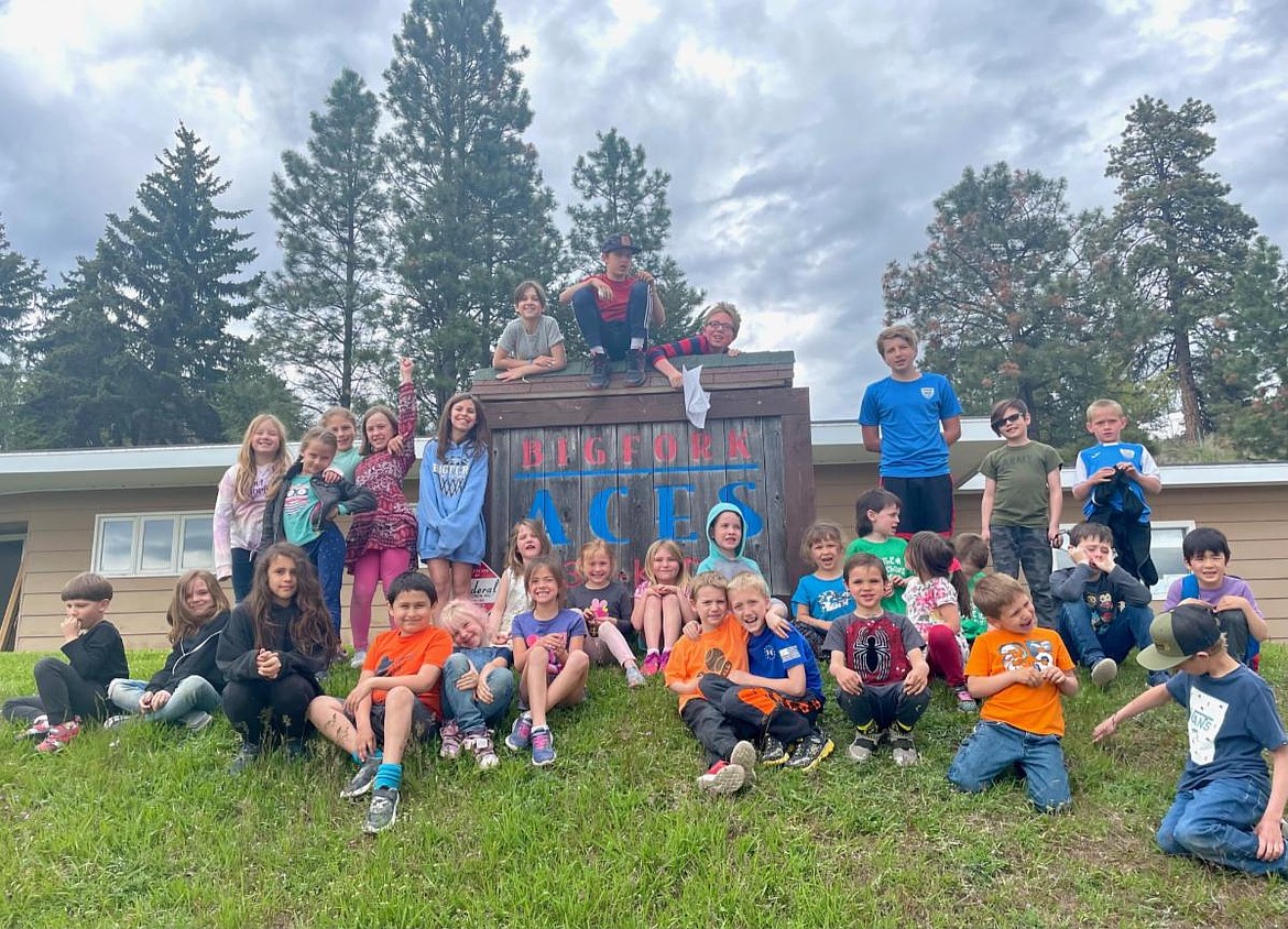 Participants in Bigfork ACES programs pose with the building. ACES will enter the Great Fish Challenge for the first time this year. (Courtesy/Bigfork ACES)