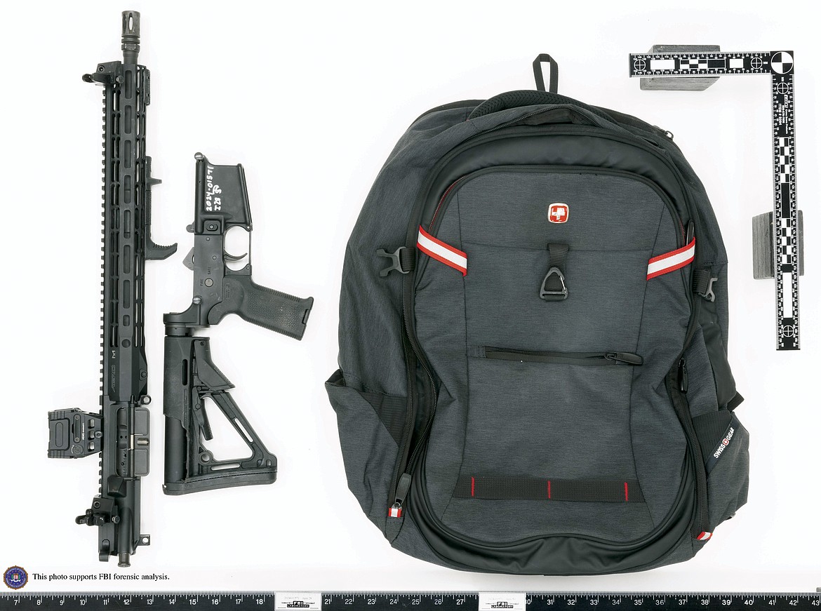 This image provided by the FBI shows Thomas Matthew Crooks' rifle broken down as was likely done for transport and the backpack recovered at the scene in Butler, Pa., July 13, 2024. Crooks searched online for events of both former President Donald Trump and President Joe Biden and saw the Pennsylvania campaign rally where he opened fire as a "target of opportunity," a senior FBI official said. (FBI via AP)