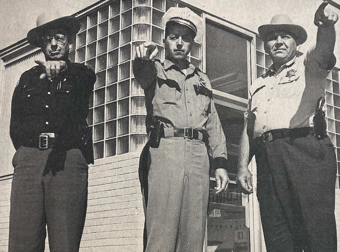 Prior to Labor Day 1964, local police, from left, Lt. Jack McGinniss of the Idaho State Police, Coeur d’Alene Police Chief George Lenz and Sheriff John Bender pointed out potential careless drivers.