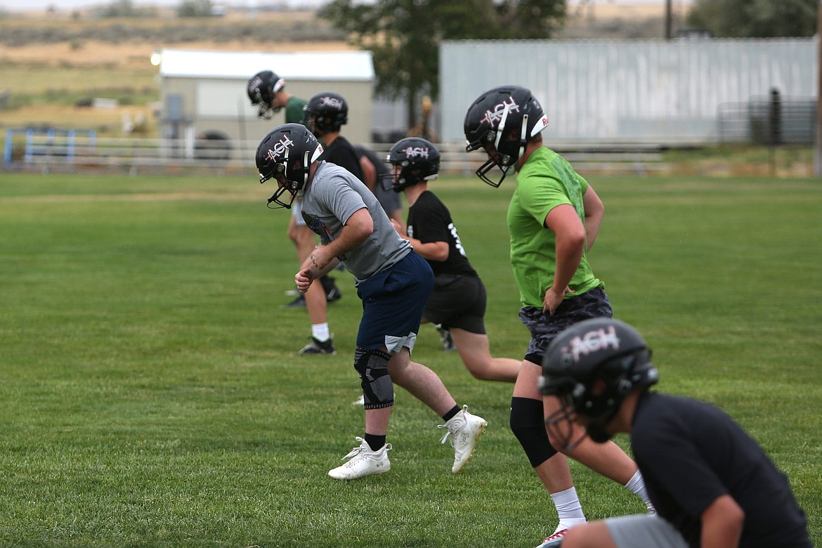 ACH players work out at the start of an August 23 practice. The Warriors will roster 35 players this season, according to Head Coach Brandon Walsh, an increase from 31 in 2023.