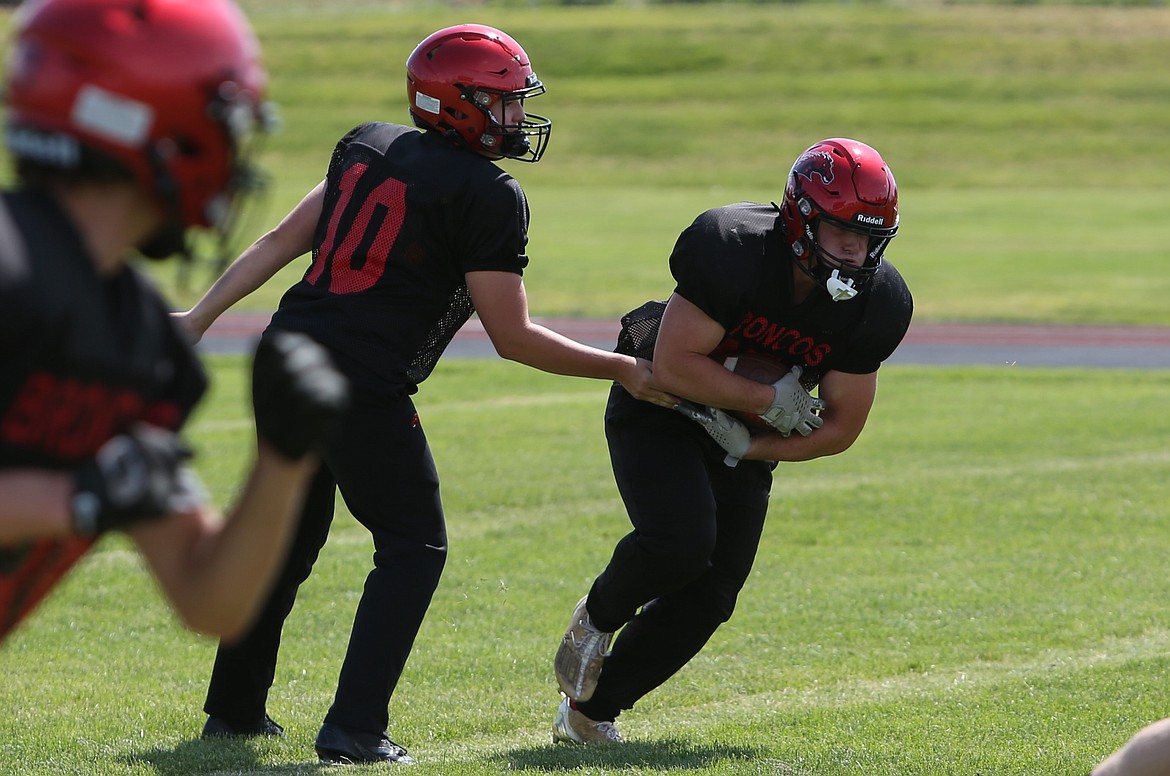 LRS running back Brody Boness takes a handoff during practice on Saturday. Boness is one of two Broncos returning who received all-league honors last fall.