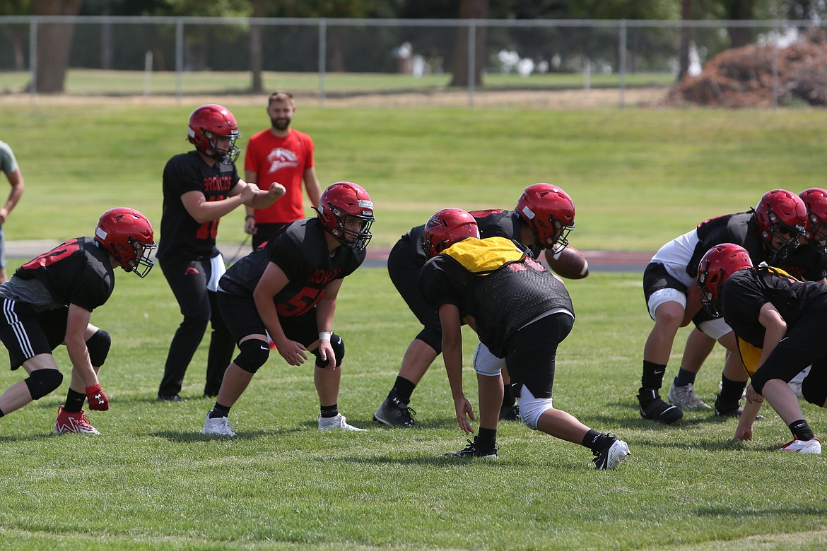 The Lind-Ritzville/Sprague offense gets set before a play during practice on Saturday. The offensive line is replacing two starters this season, both of which are at the tackle position.