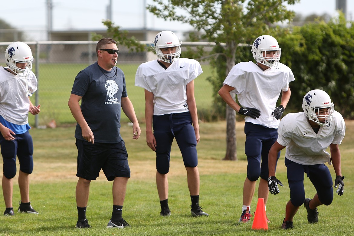 MLCA/CCS Athletic Director Josh Kast, in blue, will take over as head coach of the Lion football team this fall, replacing former coach Aaron Noble. Kast said he’s “excited” to build on the success the team found in its inaugural season in 2023.