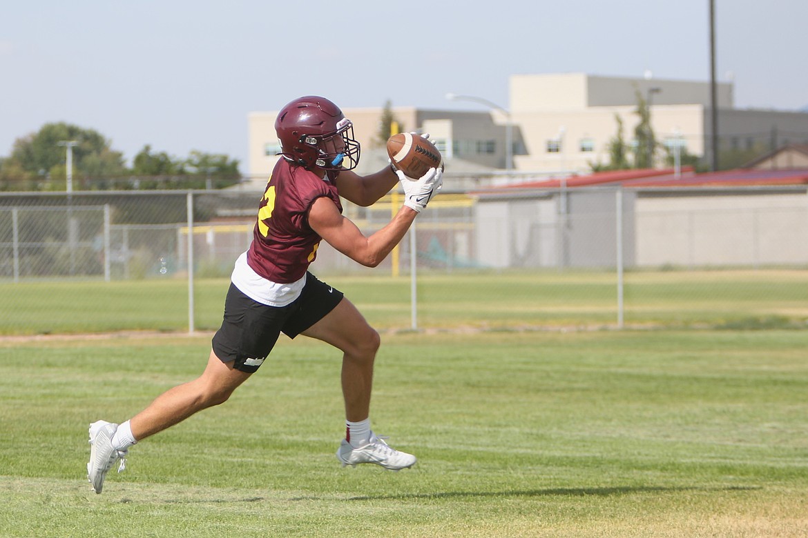 Moses Lake sophomore Taggart Rathbun hauls in a pass during practice on August 21.