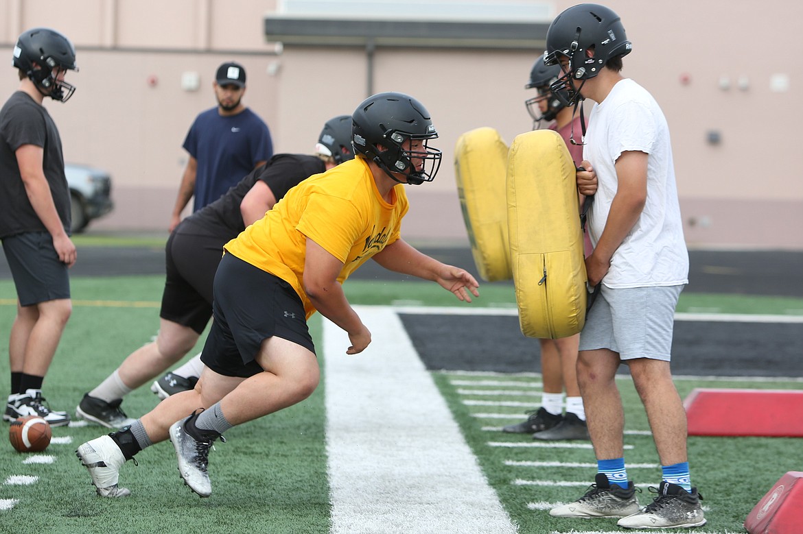 Royal defensive linemen rise out of their stance during a drill at practice on August 23. Senior Asher Garnick, a returning starter on the defensive line, said that a successful defense starts with the Knights not being pushed around up front.