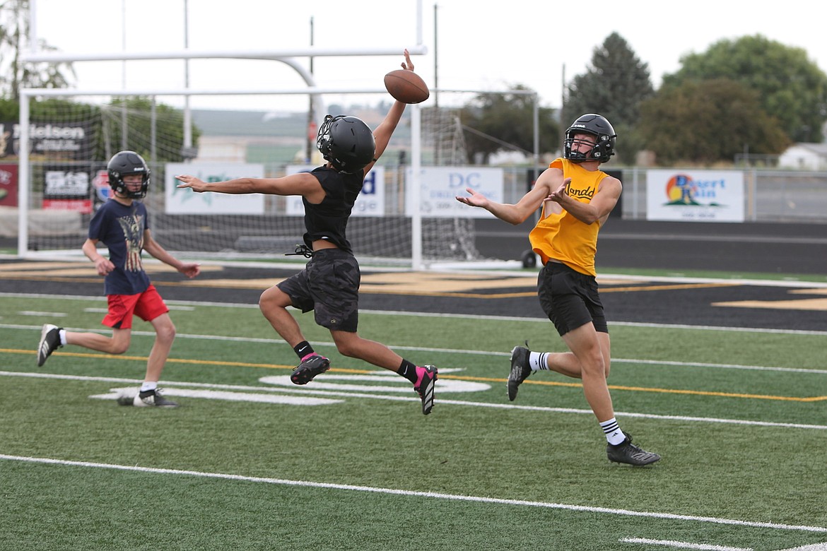 A Royal defensive back breaks up a pass during practice on August 23 in Royal City.