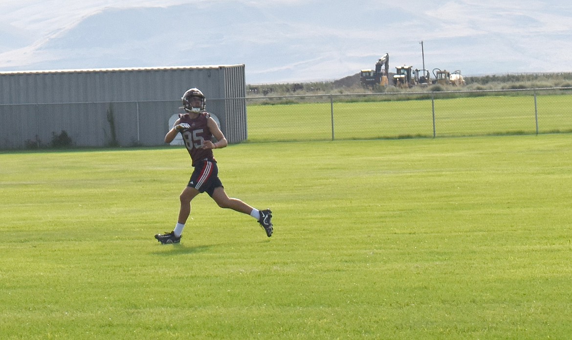 A Wahluke player chases a pass at practice Aug. 22. The team’s emphasis this year will be on offense, Head Coach Anfernee Cortez said.