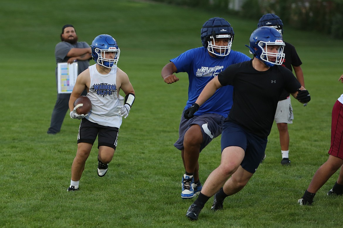 The Cougar offensive line paves out rushing lanes during practice August 22.