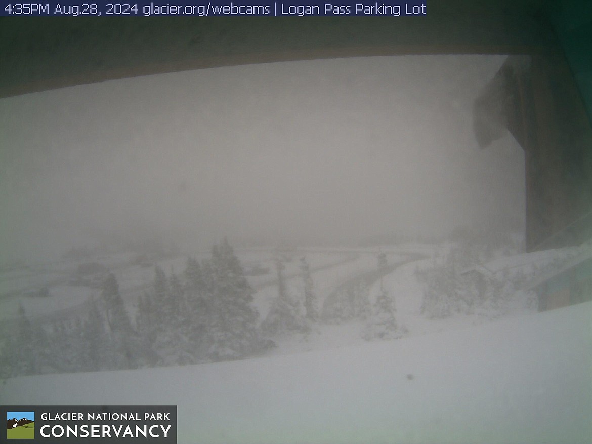 The Logan Pass Visitor Center webcam shows a snowy parking lot at 4:35 p.m. on Aug. 28, 2024. (Photo courtesy of the Glacier National Park Conservancy)