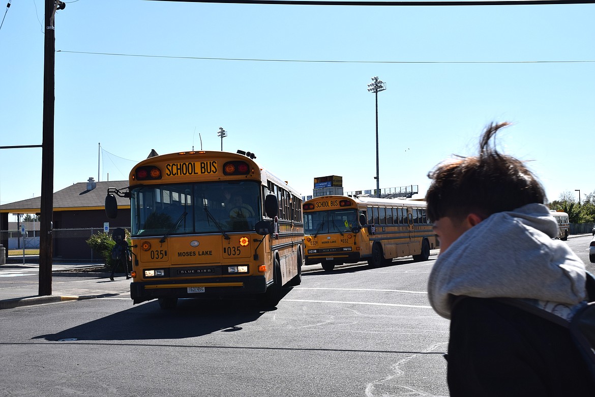 Students at Frontier middle school load onto buses after their first day back at school on Aug. 28.