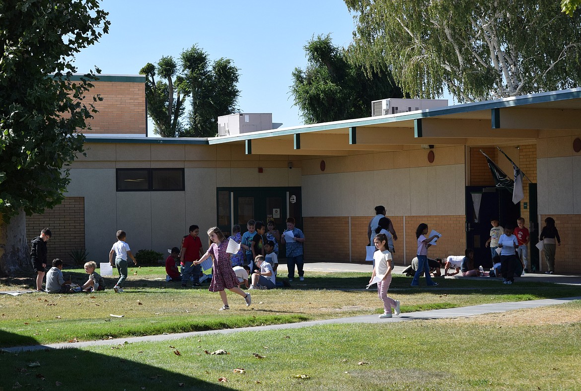 Pioneer Elementary School students ran around outside for a first day of school activity Wednesday.