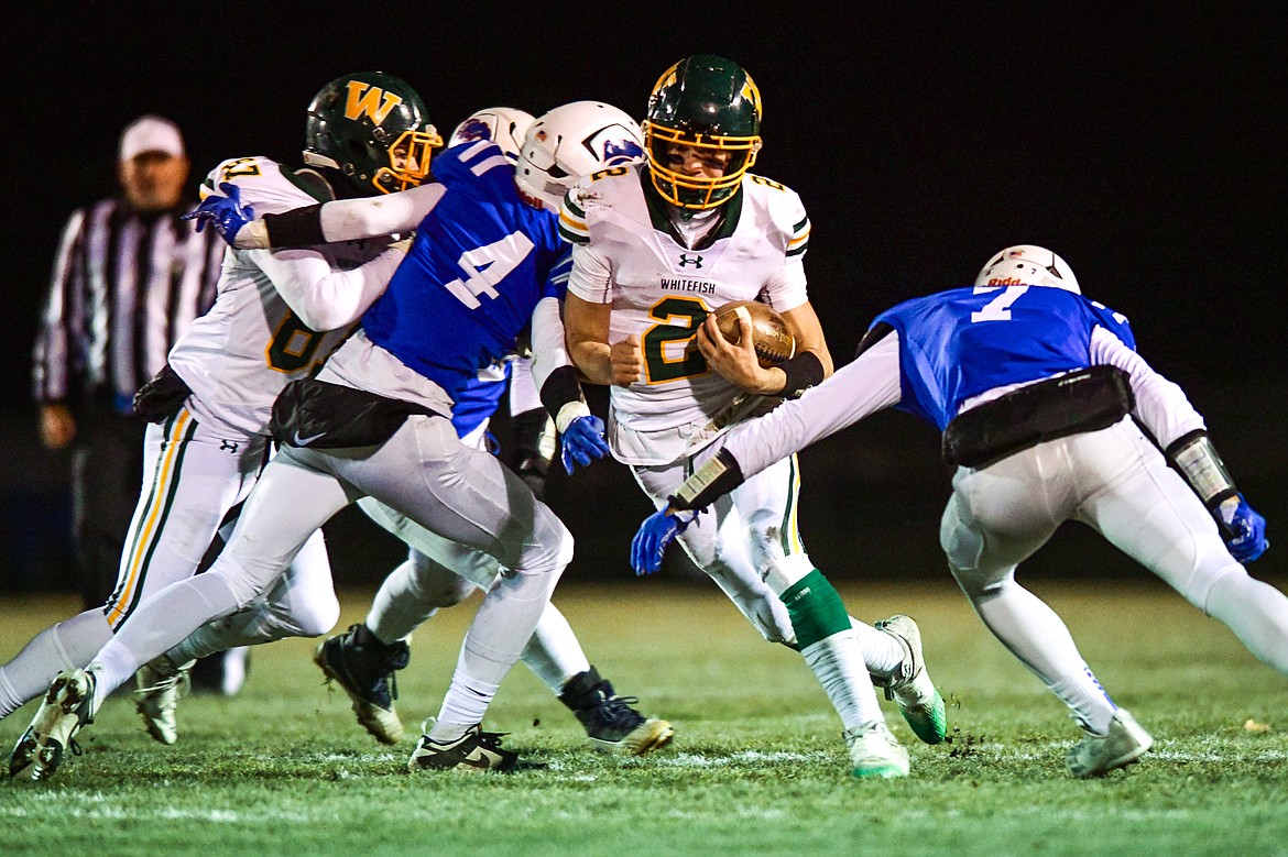 Whitefish quarterback Carson Gulick (2) picks up yardage on a run in the second quarter against Columbia Falls at Satterthwaite Field on Friday, Oct. 27. (Casey Kreider/Daily Inter Lake)