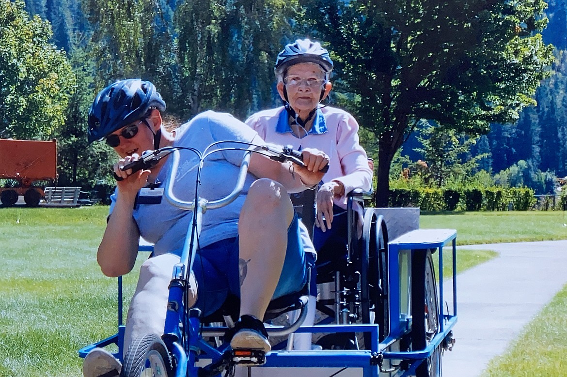 Jessica McMillan and Margaret Lindley go for a bike ride at Silverton Health and Rehabilitation of Cascadia when it was Good Samaritan.