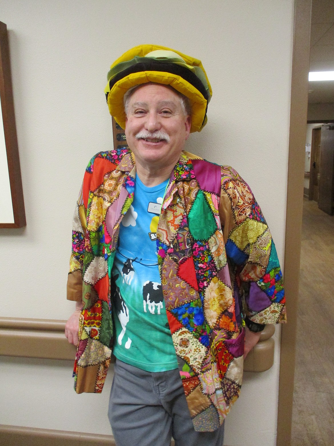 Recreational Director David Zumstein is known for keeping residents smiling, dressing in costumes like his hamburger hat.