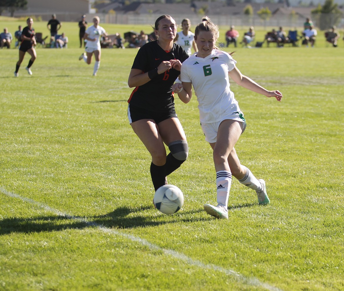 JASON ELLIOTT/Press
Lakeland senior Katie Cameron battles Post Falls senior Emma Singleton for possession of the ball during the first half of Wednesday's Inland Empire League match at Post Falls High.