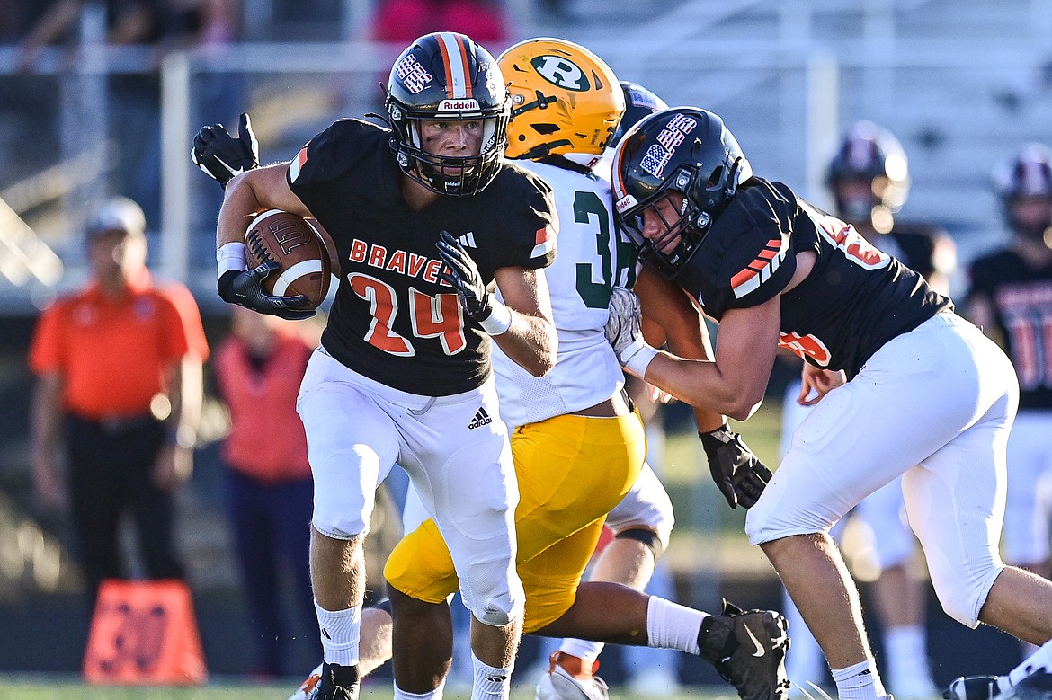 Flathead running back Nolan Campbell (24) looks for running room against Great Falls CMR at Legends Stadium on Friday, Aug. 30. (Casey Kreider/Daily Inter Lake)